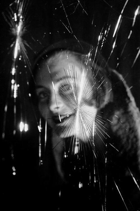 Fosco Maraini, Face seen through a broken window, c.1950