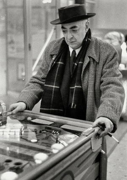 Brassaï playing pinball by Willy Ronis, 1954