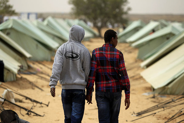 Сомалийские беженцы из Ливии в лагере у ливийской границы, Тунис.