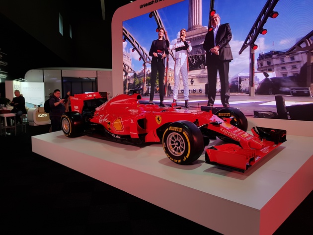 У Formula-1 был собственный стенд на выставке,...